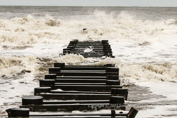 Waves pound the Rehoboth Beach jetty at Maryland Avenue