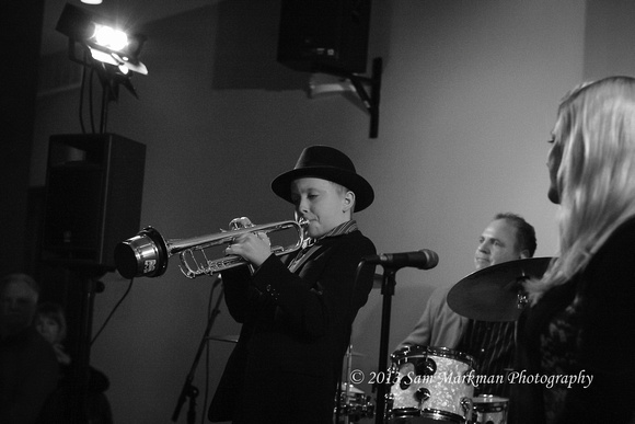 Geoff Gallante wows with his trumpet as Peggy Raley and Mike McShane (drums) look on