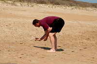 Brian checks out sea shells by the sea shore