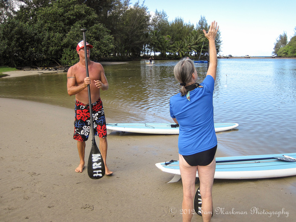 Diane adjusts her paddle for Stand Up Paddle