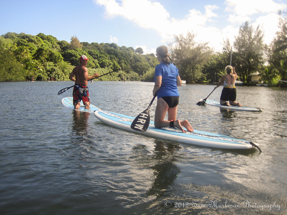 Diane & Kathy taking a lesson from Anthony in Stand Up Paddle