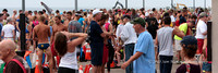 Runners gather to await swimmers leaving the water