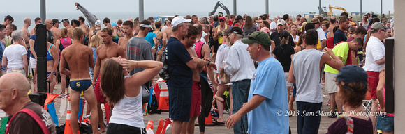 Runners gather to await swimmers leaving the water