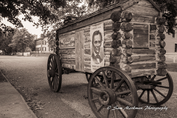 Lincoln campaign wagon w/ Abraham Lincoln's home in background