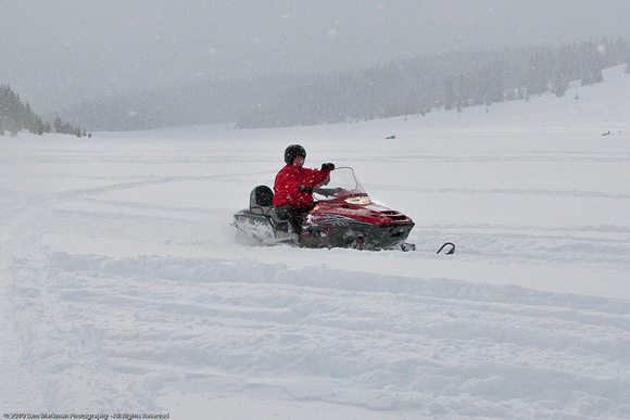 Sam takes the Snowmobile for a spin in a meadow in Routt National Forest