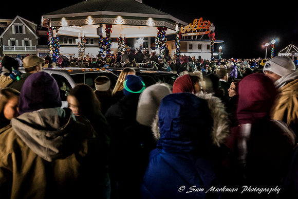 Large crowds gather at the Bandstand to await Rehoboth Beach's tree lighting and to sing Christmas carols.